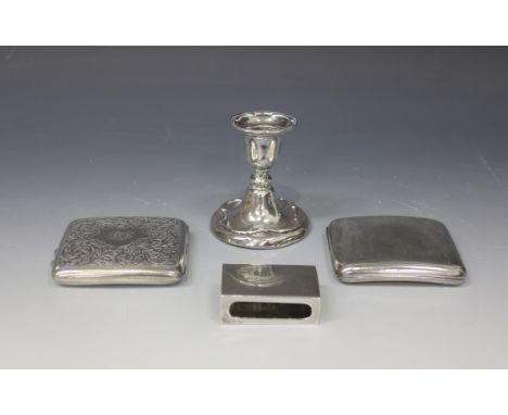 An Edwardian silver stub candlestick, the rim and base with scrolling decoration, Birmingham 1908 by A & J Zimmerman Ltd, hei