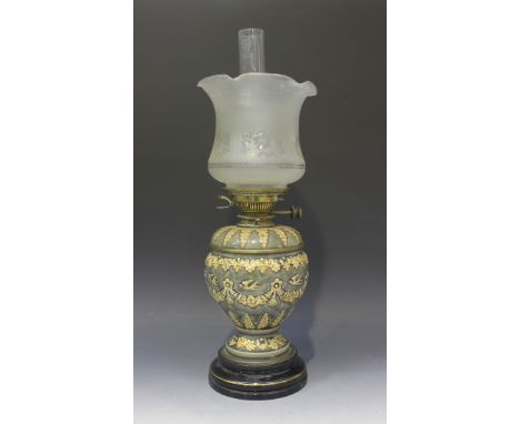 A Doulton Lambeth stoneware table oil lamp, late 19th Century, with Hinks patent brass fittings and glass reservoir above an 