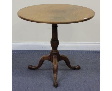 A Victorian mahogany tip-top wine table, the circular top raised on a turned column and tripod cabriole legs, height approx 7