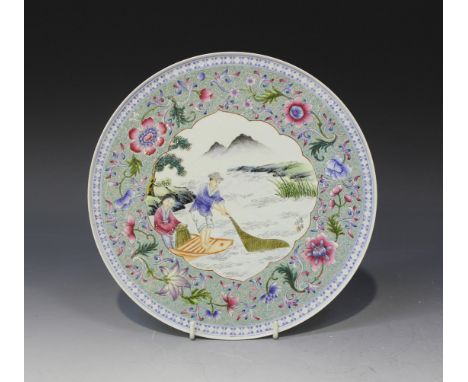 A Chinese famille rose porcelain plate, mark of Jingdezhen but 20th Century, the central foliate panel painted with a fisherm