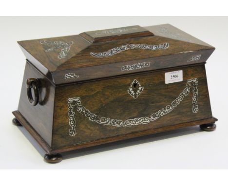 A Regency rosewood tea caddy of sarcophagus form with overall mother-of-pearl inlaid scrolls, the hinged lid enclosing a pair