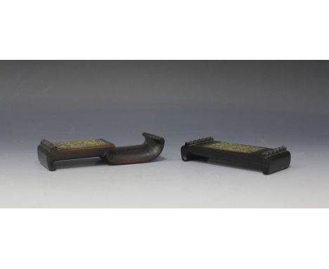 Two Chinese hardwood scholar's brush rests, late Qing dynasty, each of scroll form inset with a brass rectangular panel decor