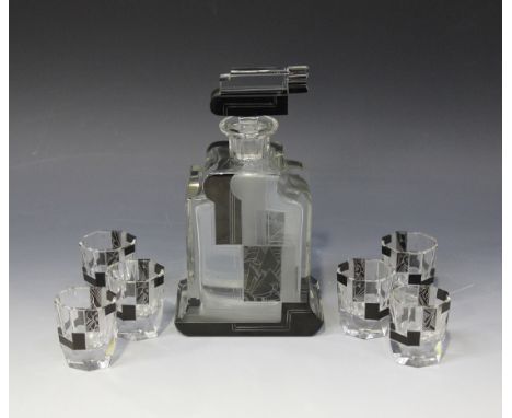 An Art Deco clear frosted and black flash overlay glass decanter and stopper, and six matching faceted shot glasses, each typ