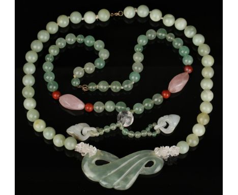 A rock crystal, rose quartz, jasper and semi-translucent pale green stone bead necklace, the front with two carved jade penda