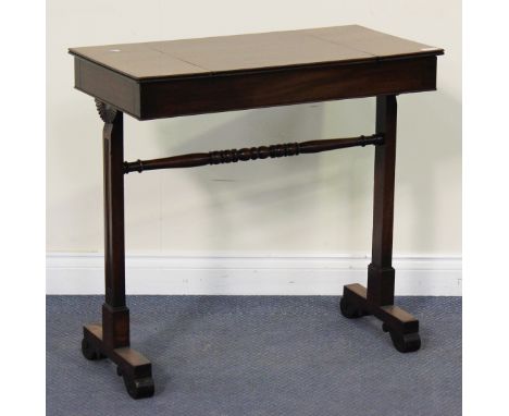 A 19th Century mahogany games table, the reversible top with an inset leather chess board above a well inset with a backgammo