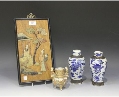 A Chinese soapstone inlaid wooden rectangular panel, 20th Century, the variegated colour soapstone carved and inlaid in low r