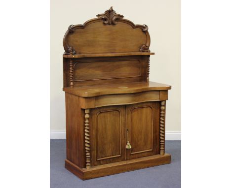 A Victorian mahogany serpentine fronted chiffonier, the arched shelf back above a drawer and cupboards, on a plinth base, hei