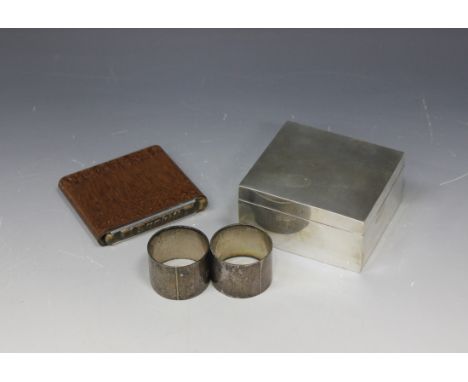 A late Victorian silver square cigarette box, Birmingham 1898 by John Edward Wilmot, width approx 10cm, a pair of silver circ