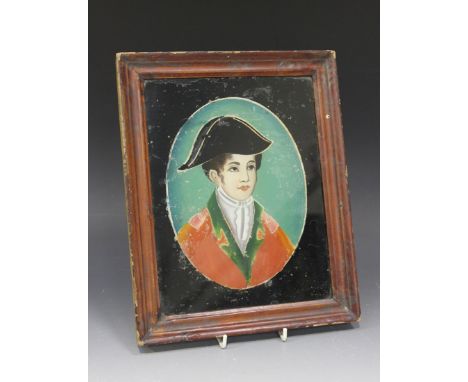 A Chinese reverse painting on glass, 19th Century, depicting a head and shoulders portrait of a European naval officer, appro