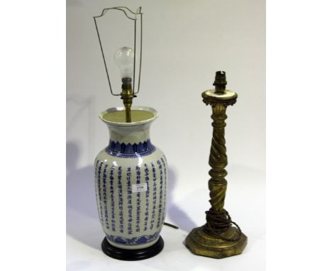 A late 20th Century Chinese blue and white ceramic table lamp, decorated with overall script, height approx 37cm, together wi