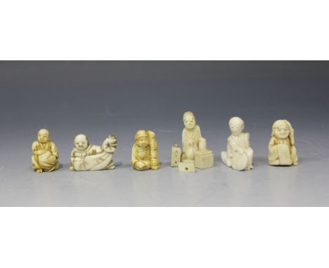 A group of six Japanese carved ivory okimono and netsuke, Meiji period, including one okimono in the form of a seated daruma 