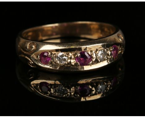A 9ct gold, ruby and diamond five stone ring, mounted with three circular cut rubies alternating with two circular cut diamon