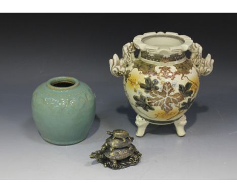 A Japanese Satsuma earthenware tripod koro, Meiji period, decorated with leaves and flowers (lacking cover), together with a 