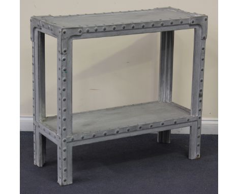 A late 20th Century Industrial style two-tier side table with metal studded borders, height approx 91cm, width approx 98cm.