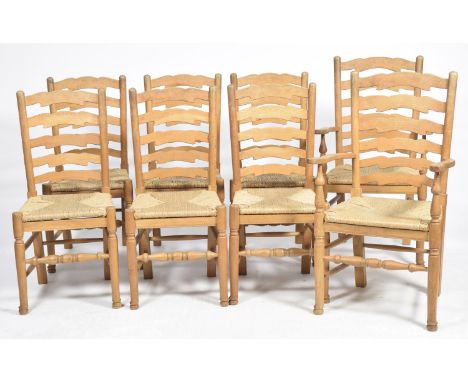 A set of eight 18th Century style light oak ladder back kitchen chairs, 20th CenturyEach chair with a five rung back above an