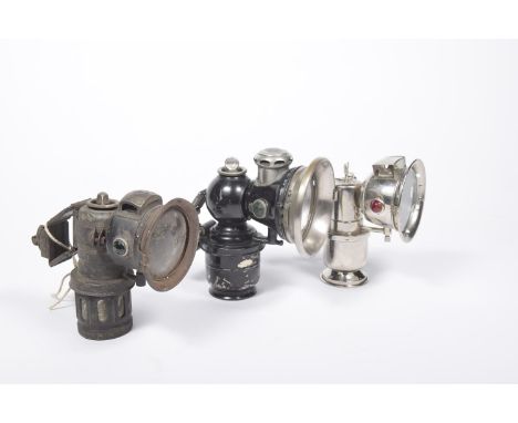 Three vintage cycle lampsTo include a No.5 Lucas model Calcia Toura No.153, a Miller carbide gas cycle lamp circa 1920s and a