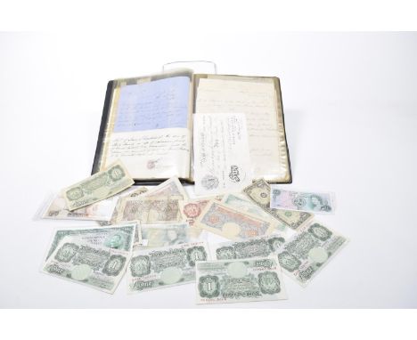 A Bank of England white £5 note dated March 22 1947Cashier K O Peppiatt.Serial Number L72054592, six £1 notes cashier D S Bea