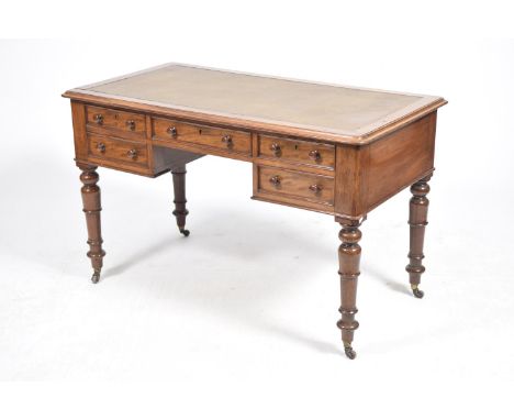 A Mid 19th Century mahogany writing desk The rectangular moulded leather inset top above an arrangement of five drawers each 