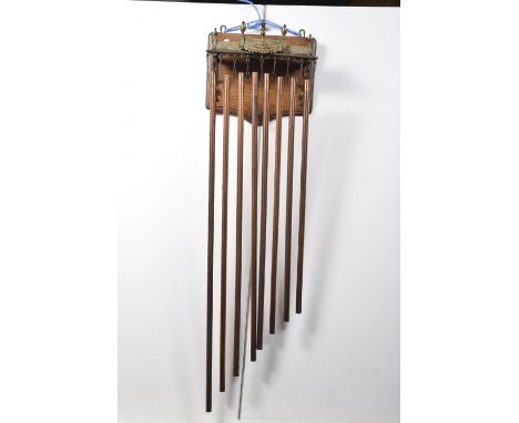An unusual early 20th Century hanging tubular dinner gongHaving an oak plaque applied with a brass pagoda roof type bracket a