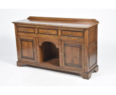 A good quality George III style oak and mahogany crossbanded dresser base by Fron Furniture The rectangular moulded and cross