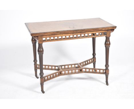 A Victorian bur walnut folding games tablesThe rectangular folding top inlaid with stringing above a spindled gallery frieze 