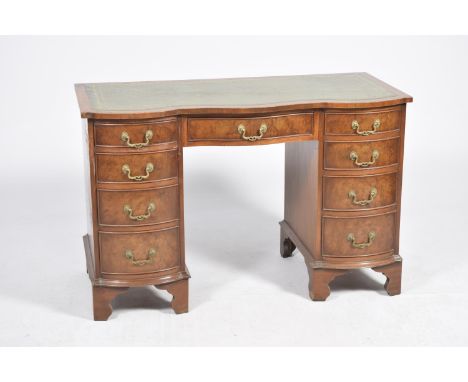 A good quality Queen Anne style serpentine walnut deskThe serpentine top inset with a green leather and gilt-tooled writing s