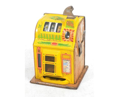 A vintage Mills Novelty Co Bell Fruit Gum fruit machine one arm bandit The cast metal game with three dials later painted in 