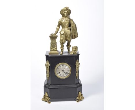 A late 19th Century French slate mantle clockThe clock surmounted with a brass figure of a musketeer above the 9cm silvered d