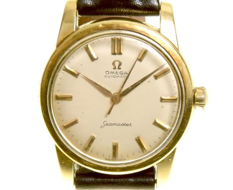 A mid 20th century Omega Seamaster automatic wristwatchThe circular cream dial with baton hour markers, signed Omega, within 