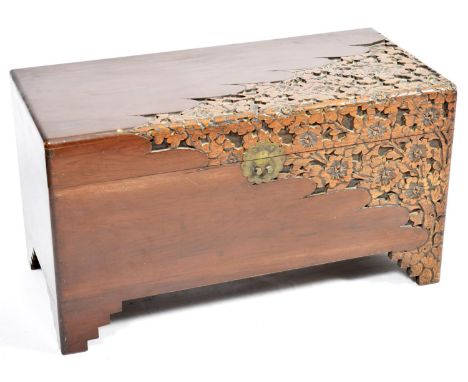 A late 19th, early 20th Century Chinese carved camphor chestThe chest carved in deep relief with flowering leafy branches, th
