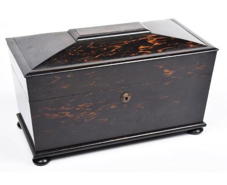 A 19th century Sarcophagus shaped Coromandel tea Caddy by Mechi and Bazin London.The hinged cover enclosing three compartment