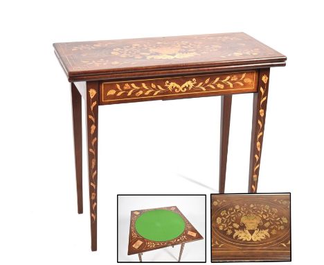 A stunning 19th Century Dutch marquetry folding mahogany games table The rectangular hinged top inlaid with a central foliate