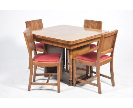 A 1930's Art Deco walnut dining room suiteComprising a sideboard with two drawers and two cupboard doors applied with rail ha