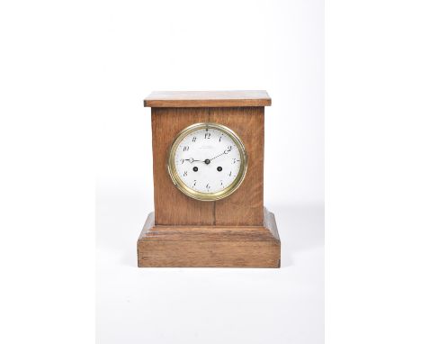 A 19th Century oak cased mantle clock by Charles Frodsham, London The plain oak case enclosing the 14cm enamelled white dial 