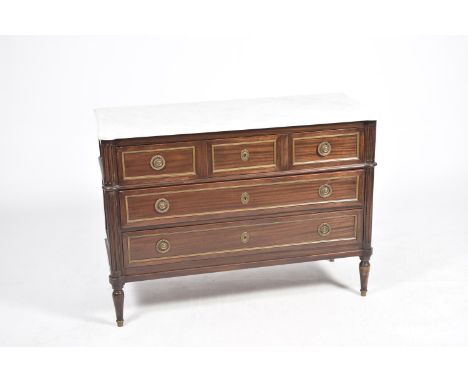 A late 19th Century French marble top mahogany commode Having a shaped white marble slab top above an arrangement of three sh