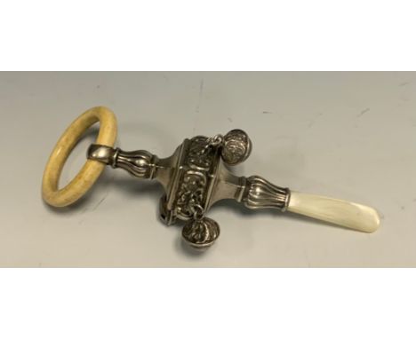 A George V silver, mother-of-pearl and bone baby's rattle, four bells, 13cm long, Crisford &amp; Norris Ltd, Birmingham 1915 