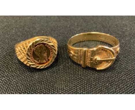 A 9ct gold buckle ring, size U, 4.4g;  a 9ct gold Mexican coin signet ring, Maximiliano Emperadon, size L, 1.8g gross 