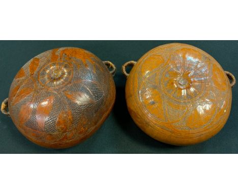 A 19th century Corsican gourd flask, sgraffito engraved with a figure on horseback and stylised leaves and flowers, cord lug 