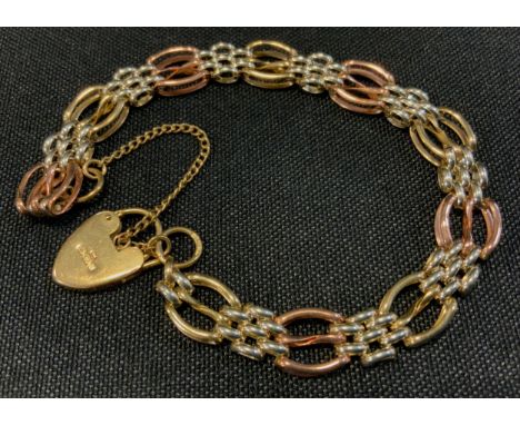 A 9ct gold fancy link two tone gate bracelet, padlock clasp, 13.3g gross 