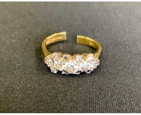A diamond ring, set with five principle round brilliant cut diamonds above eight smaller conforming pairs of accents (four mi