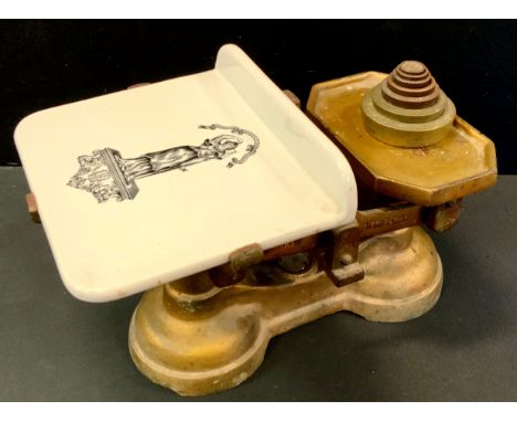 A pair of Fairbanks of Birmingham balance scales, pottery plate, seven tower weights 