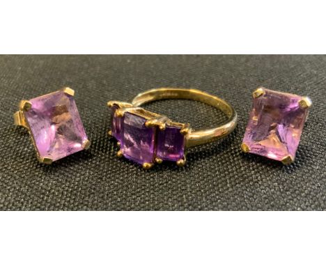 A vibrant purple amethyst platform ring, 9ct gold shank, size N/O, 2.7g gross;  pair of similar rectangular pale pinky purple