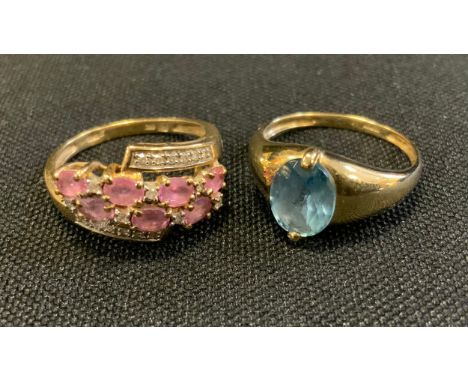 A 9ct gold diamond and pink stone ring, stamped 9K 375 Qvc, size P, 2.8g gross;  another blue topaz signet ring, 9ct gold sha