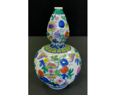 A Chinese double gourd vase, painted with butterflies amongst flowers, 21.5cm high, seal mark 