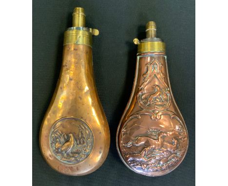 A 19th century copper shot flask, embossed with a deer stalking scene, sprung mechanism, 18.5cm long; another, embossed with 