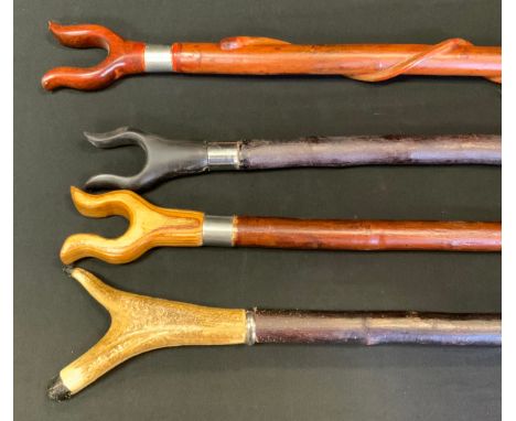 A 20th century waking stick, U shaped thumb rest, 132cm long;  others (4) 