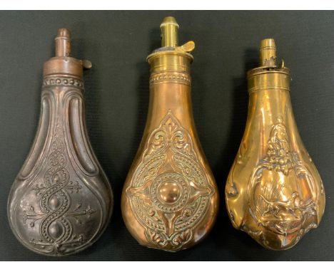 A 19th century brass shot flask, embossed with a sporting dog, patent spout, 18cm long; others (3) 