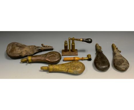 A brass Sykes patent powder flask, three shot levels, embossed body;  others Hare and Grouse;  leather; James Dixon &amp; Son