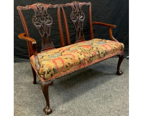 An Edwardian mahogany two seat salon sofa, carved back, cabriole legs, ball and claw feet c.1910 