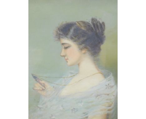 Edwardian School. Portrait of a lady looking at a portrait miniature, oil on Winsor &amp; Newton canvas. unsigned, auction ho